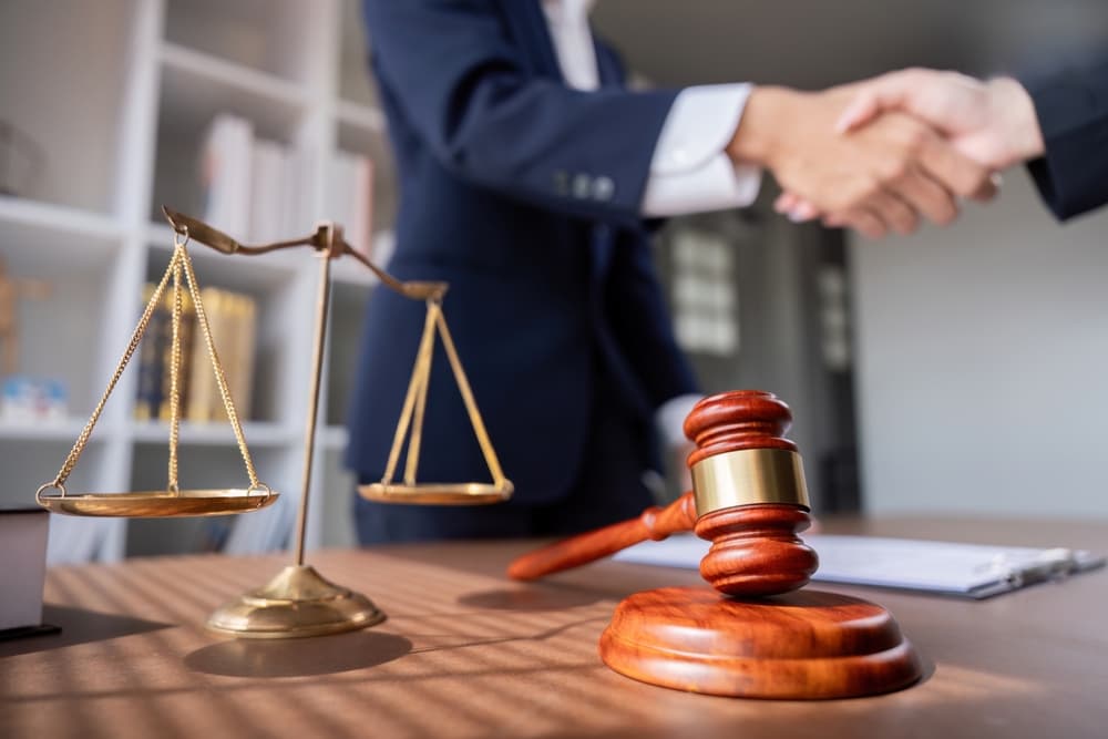 Rideshare lawyer handshake with client